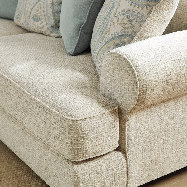 Sofa featuring t-cushion seating and setback roll arms angled for modern flair.