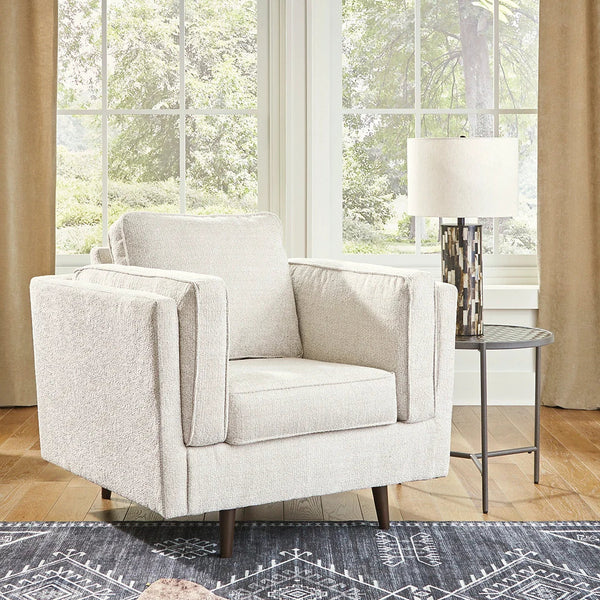 Mid-century revival chair with sheltering arms and sandstone fabric upholstery