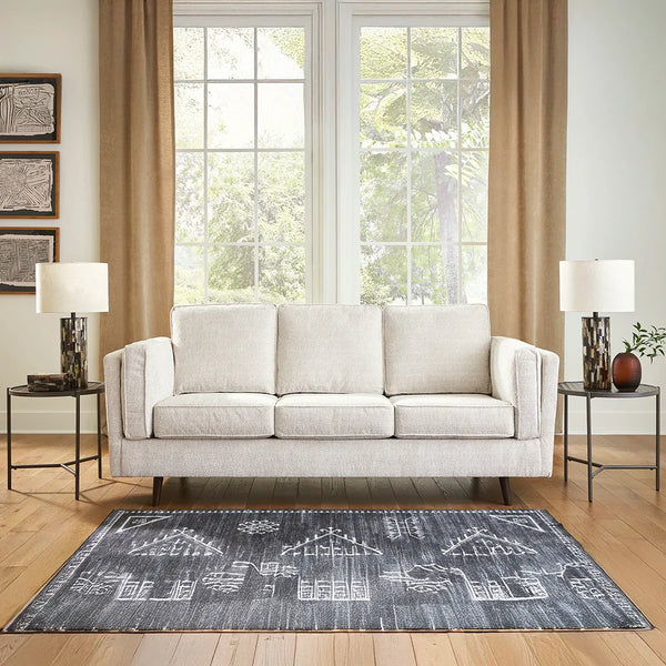 Mid-century inspired sandstone sofa with sheltering arms – Ashley UAE.