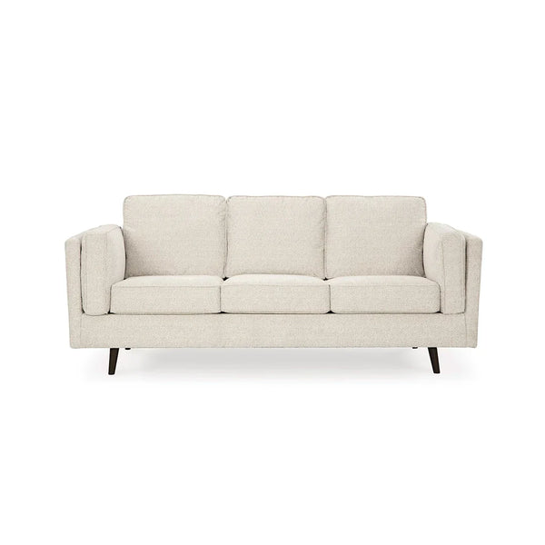 Designer sofa with reversible cushions and bolster pillows.