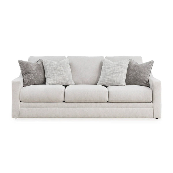 Contemporary sofa with textured accent pillows.