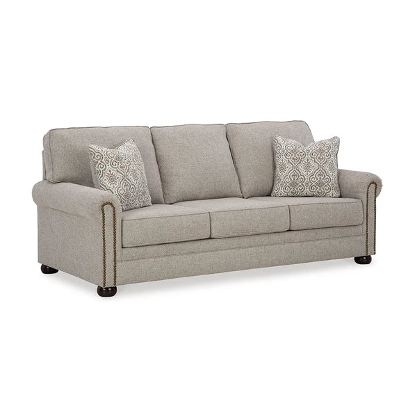 Elegant polyester sofa with accent pillows and classic details.