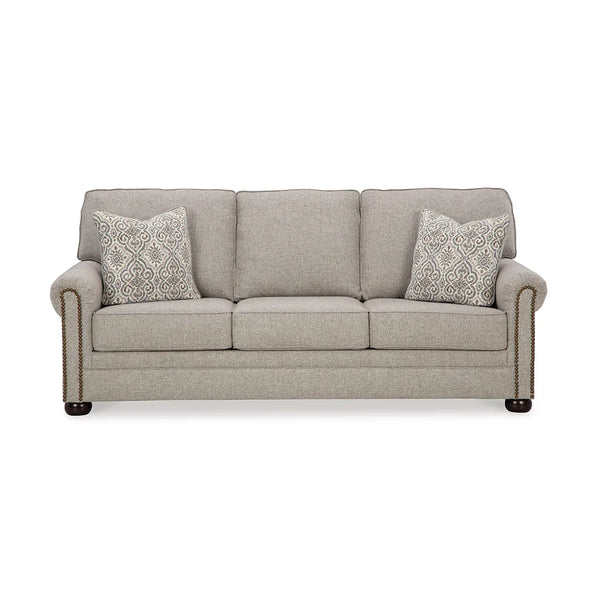 Comfortable sofa with attached back and loose seat cushions.