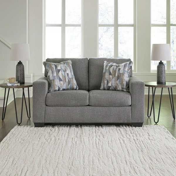 Loveseat with soft, textural polyester upholstery and attached back cushions.