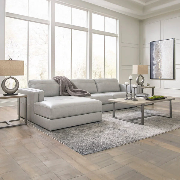 Contemporary leather sectional with sleek double-padded arms and low profile