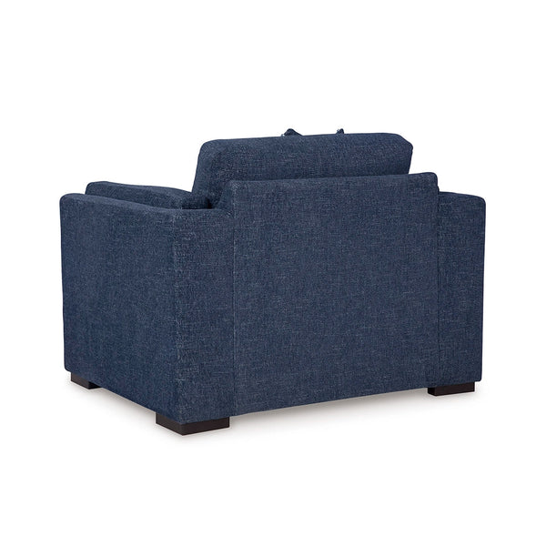 Low-profile faux wood finish legs on navy oversized chair