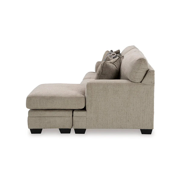 Beige sectional sofa with plush seating and neutral tones