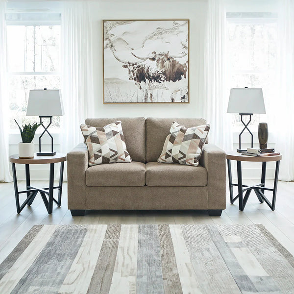 Bristaview loveseat with supple polyester upholstery and attached back cushions.