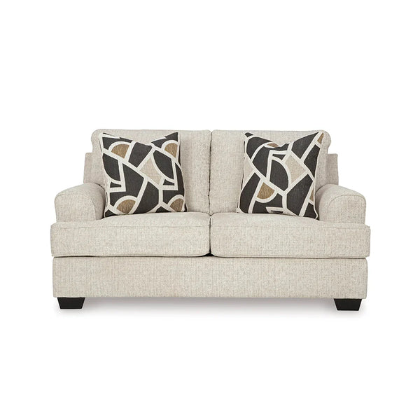 Loveseat featuring attached back and loose seat cushions with high-resiliency foam.