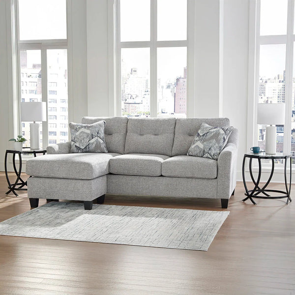 Neutral chenille upholstered sofa chaise with accent pillows