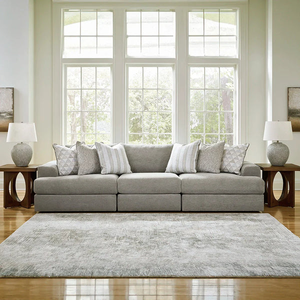 Avaliyah modular corner sofa in gray with deep seating, beveled block arms, and waterfall cushions – versatile sofa couch for living room.