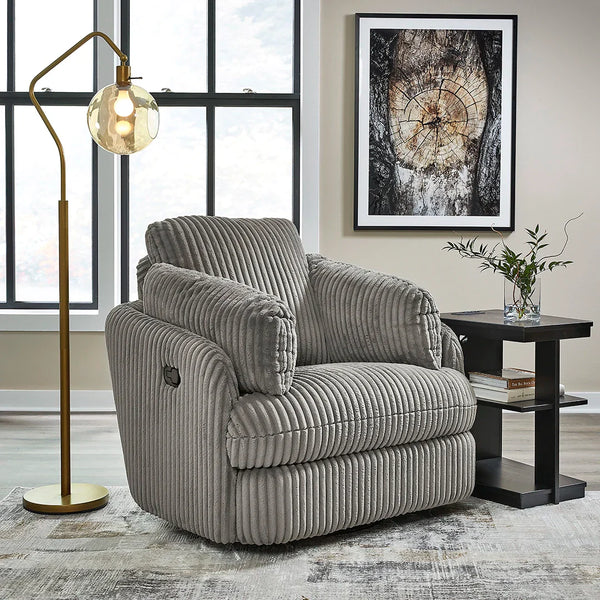 Barrel-shaped recliner with soft cord upholstery, swivel base, and hidden storage – Ashley UAE