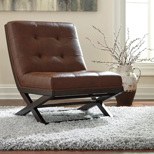 Sidewinder accent chair with scissor base and faux leather upholstery