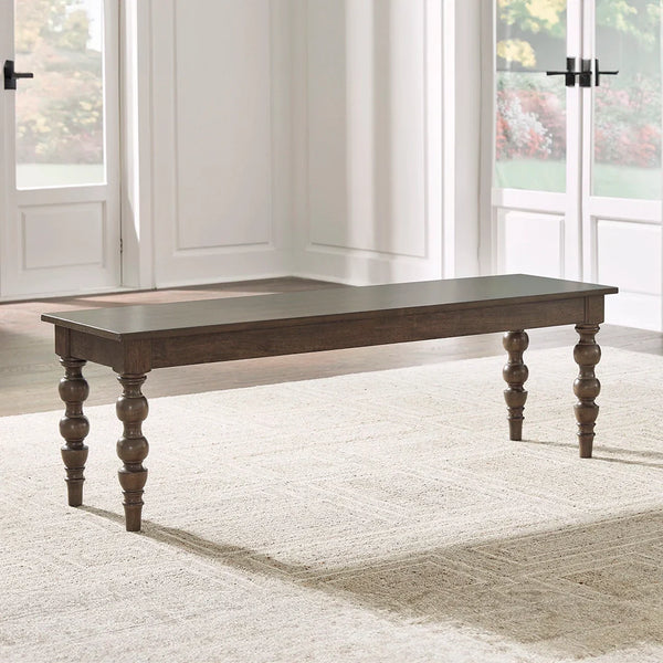 Ashley UAE Veramond dining bench with rich brown walnut finish and traditional ball legs