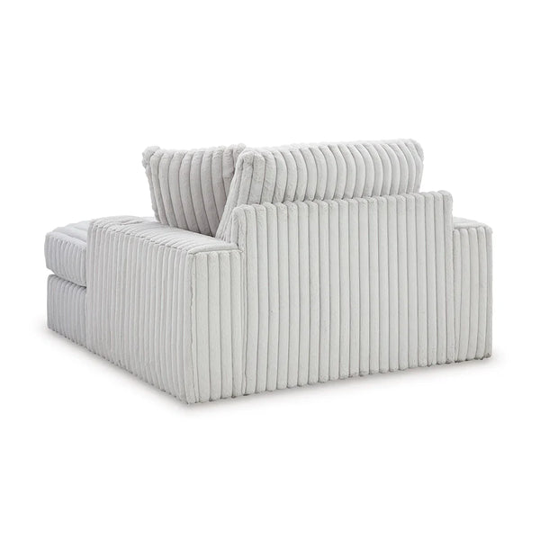 Modern oversized chaise with cup holders, USB charging, and plush feather-fiber cushions in retro-cool design