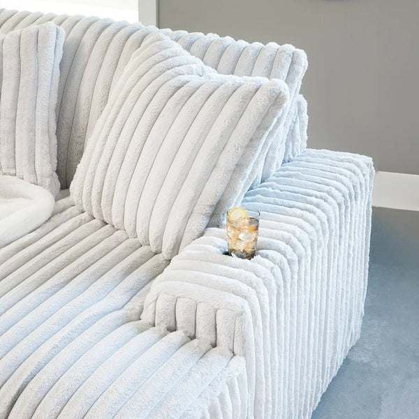 Cozy chaise lounge with reversible cushions, non-skid legs, and durable corner-blocked frame for lasting comfort