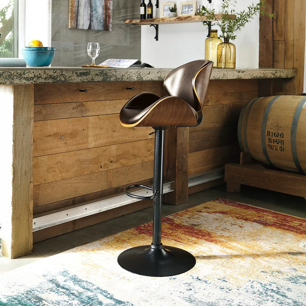 Modern swivel bar stool with contoured back and brown faux leather seat