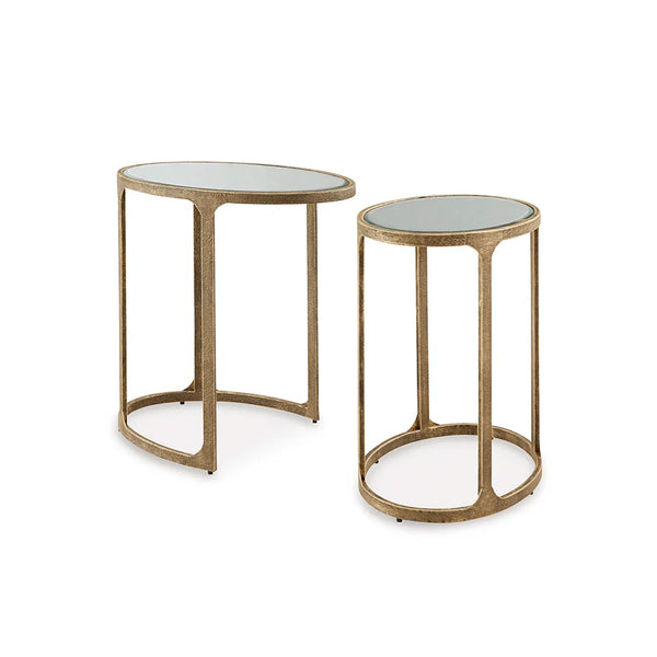 Elegant oval nesting tables featuring antique gold finish and reflective mirror surfaces.