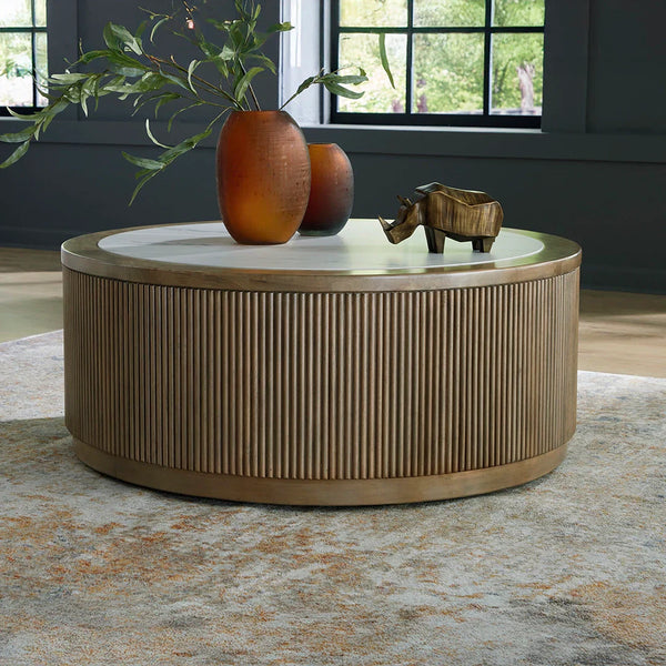 Camdill coffee table with faux marble top and reeded base in light brown and white finish.